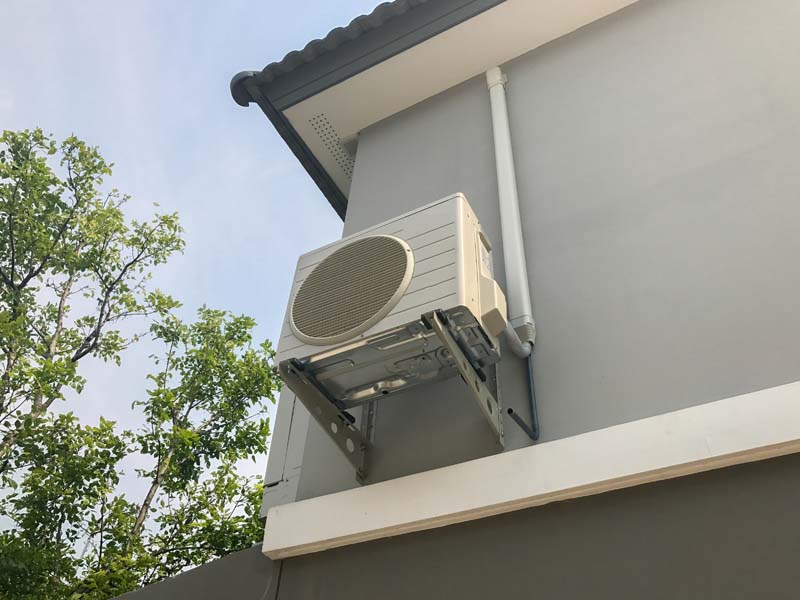 A air conditioner compressor outside of a residential unit. What does AC SEER mean?